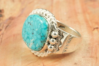 Genuine Blue Moon Turquoise set in Sterling Silver Ring. The Blue Moon Turquoise Mine is located in Esmeralda County, Nevada. It closed in the late 1970's. Blue Moon Turquoise is now obtained from private collections. Created by Navajo Artist Tony Garcia. Signed by the artist.